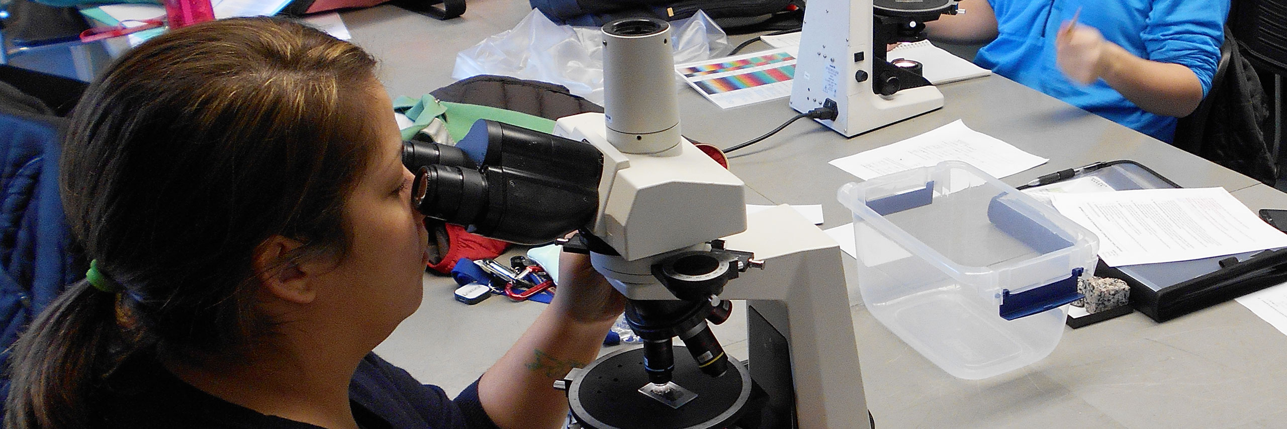 Student interacts with the equipment at her lab station.